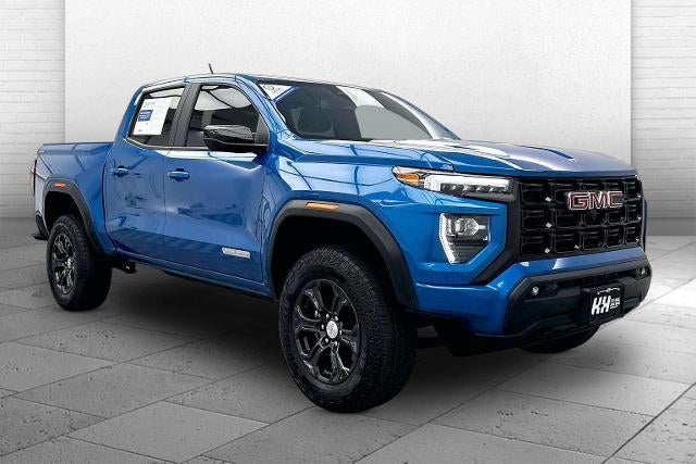 2023 GMC Canyon Elevation in Dynamic Blue Metallic — front three-quarter view