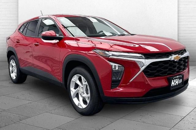 2026 Chevrolet Trax LS in Apex Red — front three-quarter view